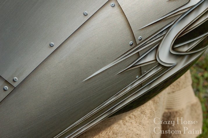 Closeup of metal effect graphic and rivits on tank. Note the brushed aluminum effect basecoat.