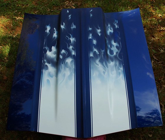 We painted white rally stripes turning into real fire flames on a Chevelle hood.