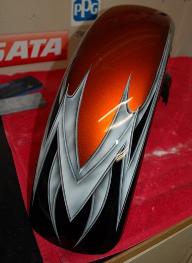  Metal effect razor style graphics on a black and orange two tone.